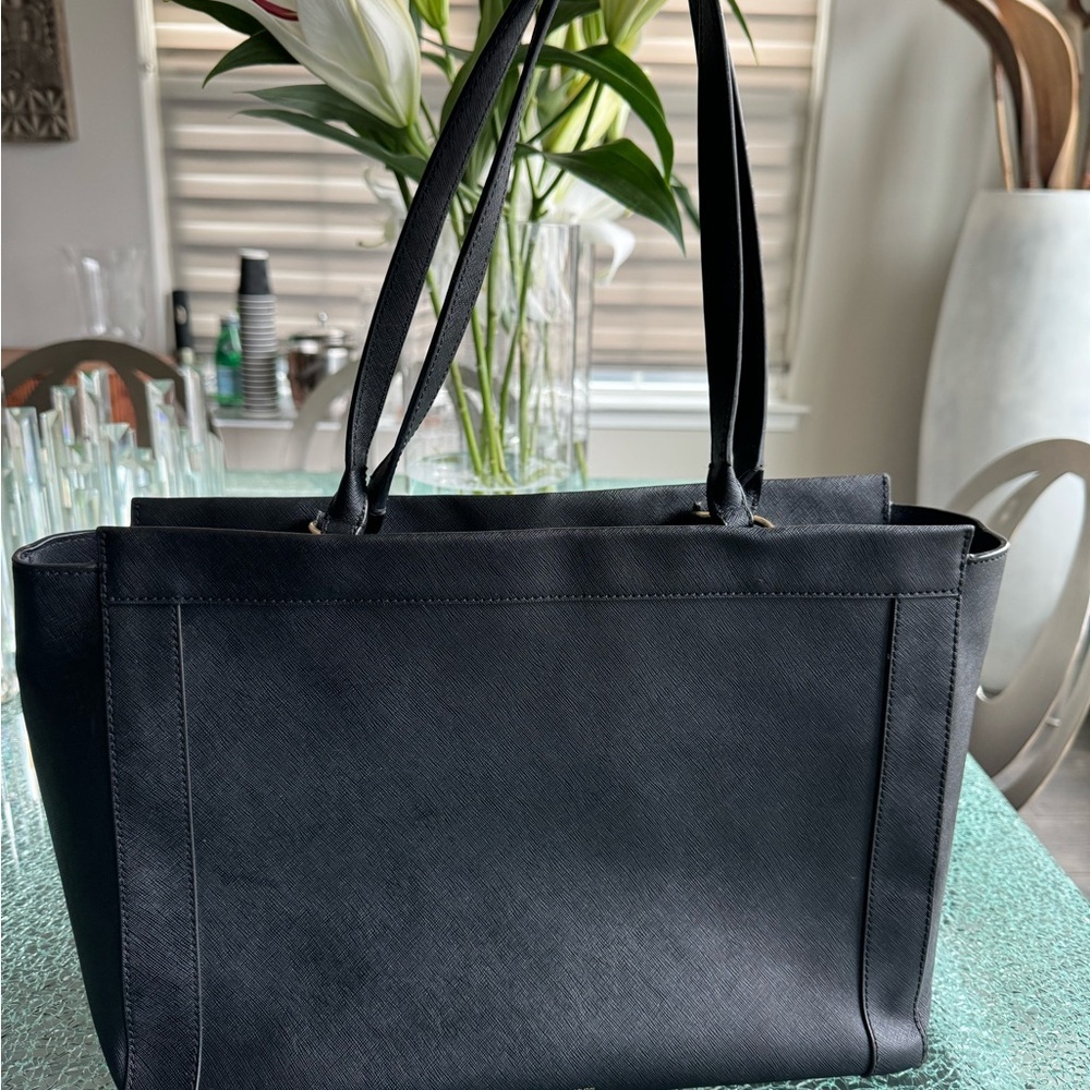 Sleek Black Tote‎ Bag with Structured Shape and Long HandlesRebecca Minkoff Bag